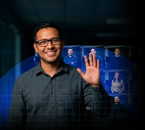 Kommit team member waving